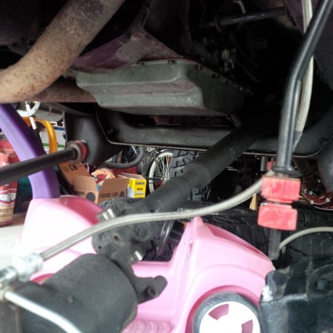 1978 Ford Bronco - Undercarriage components are visible above a pink toy car.