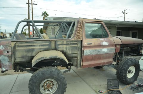 1979 Ford Bronco - This modified Ford Bronco features a roll cage and large off-road tires, with significant bodywork visible.
