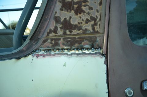 1979 Ford Bronco - Welding repairs are visible on the body of a vehicle, indicating bodywork in progress.