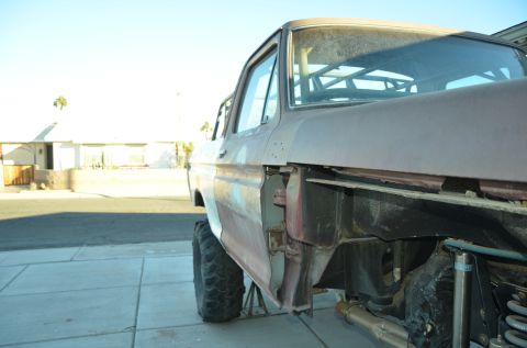 1979 Ford Bronco - Driver's side front fender and wheel well of a Ford Bronco, showing bodywork in progress.