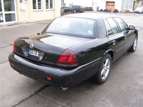 2003 Mercury Marauder - Rear view of a black 2003 Mercury Marauder sedan parked on pavement.