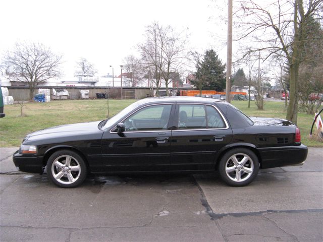 Side view of a black 2003 Mercury Marauder parked on pavement