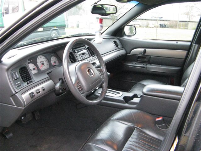 Interior view of a 2003 Mercury Marauder showing dashboard, steering wheel, and leather seats