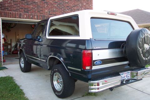 1992 Ford Bronco - Rear view of a 1992 Ford Bronco with a spare tire mounted on the back.