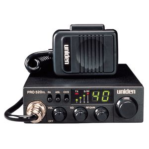 1996 Ford Bronco - A Uniden PRO 520XL CB radio and its attached microphone are shown against a white background.