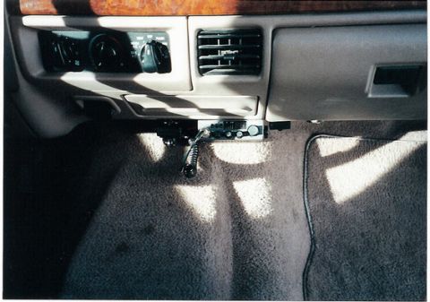 1996 Ford Bronco - Interior view of a 1996 Ford Bronco, showing the dashboard with a CB radio installed below the air conditioning vent.