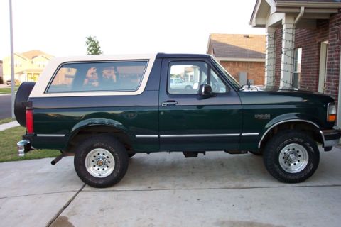 1992 Ford Bronco - This 1992 Ford Bronco is parked on a concrete driveway in front of a brick house.