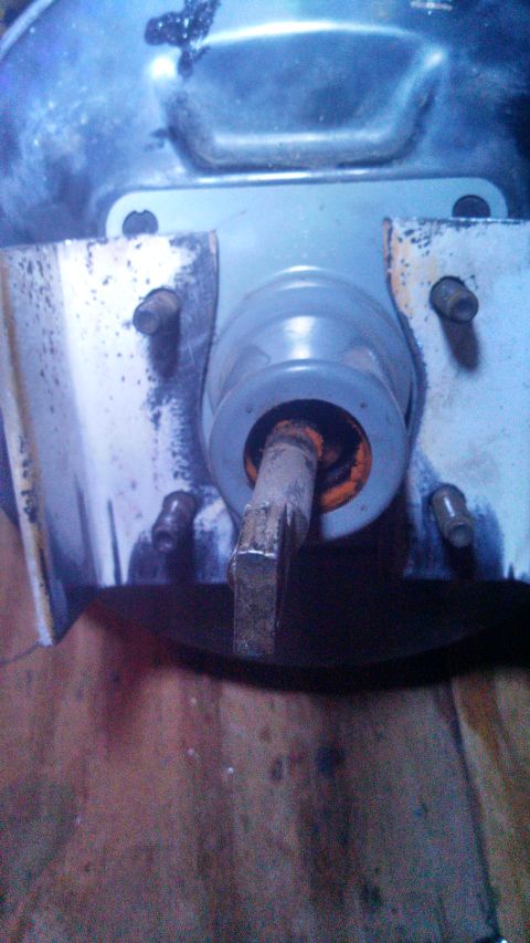 1979 Ford Bronco - Close-up of a brake booster assembly, showing mechanical components and mounting hardware.