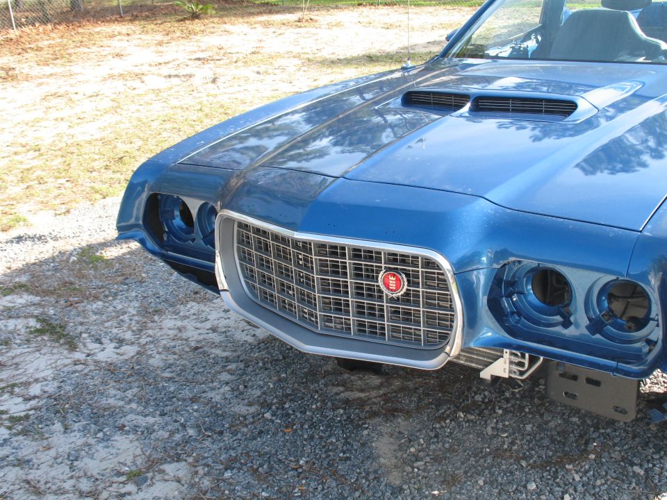 Blue 1972 Ford Ranchero front end with prominent grille and hood scoops