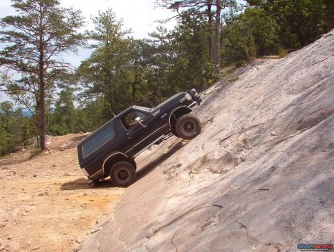 1988 Ford Bronco - This 1988 Ford Bronco is tackling a challenging rocky ascent.