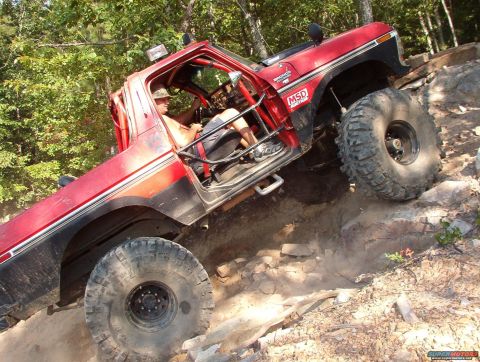 1988 Ford Bronco - This modified 1988 Ford Bronco navigates a challenging rocky incline off-road.