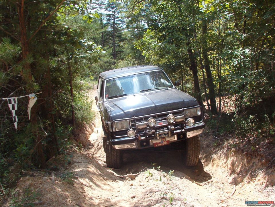 Black 1988 Ford Bronco on a dirt trail