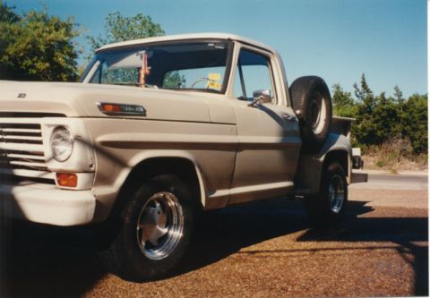 1968 Ford F-100 - A tan 1967 Ford F-100 pickup truck is parked outdoors under a clear blue sky.