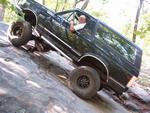 1988 Ford Bronco - This 1988 Ford Bronco navigates a challenging rocky trail, its off-road capabilities.