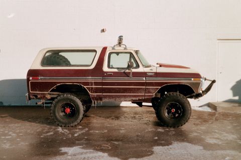 1979 Ford Bronco - This modified Ford Bronco features a two-tone paint scheme and is lifted with large off-road tires.