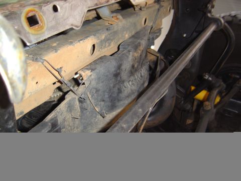 1986 Ford Bronco - Undercarriage view of a vehicle, focusing on suspension and frame components.