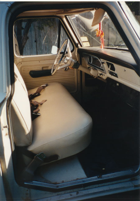 1968 Ford F-100 - The interior of this truck, with its distinctive dashboard and steering wheel, suggests a model year around 1967.