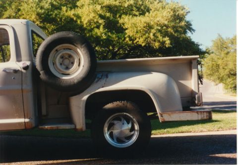 1968 Ford F-100 - This 1968 Ford F-100 pickup truck is seen from the side, its spare tire mounted on the exterior.