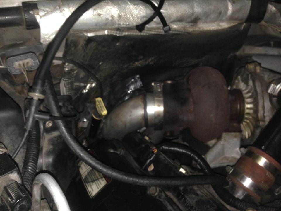 Turbocharger and exhaust piping in an engine bay
