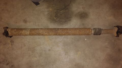 1995 Ford Bronco - This is a driveshaft, likely removed from a vehicle for repair or replacement.