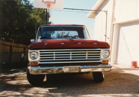 1967 Ford F-100 - Front view of a red 1967 Ford F-100 pickup truck parked in a driveway.