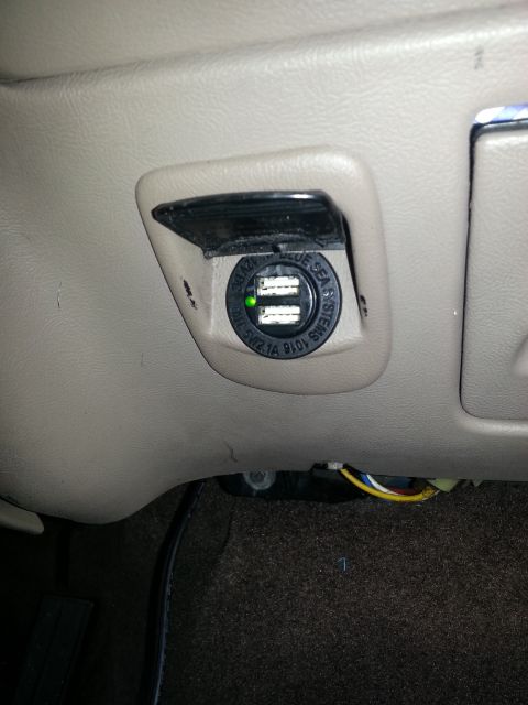 1994 Ford Bronco - Photo of a tan vehicle dashboard with an installed Blue Sea Systems dual-USB power-point charger.