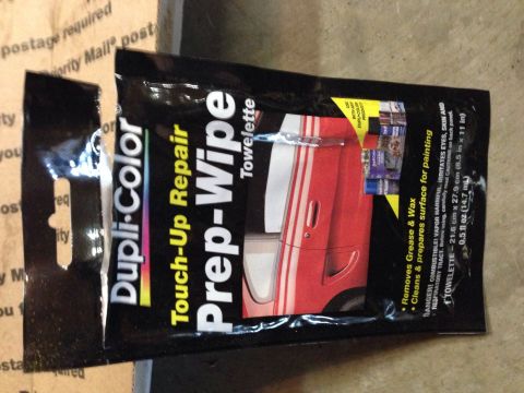 1979 Ford Bronco - A black and yellow package of Dupli-Color Touch-Up Repair Prep-Wipe Towelettes is shown against a cardboard background.