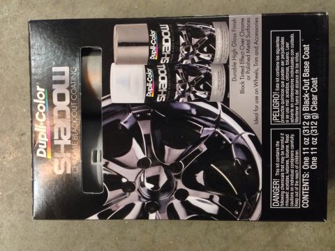 1979 Ford Bronco - A box for Dupli-Color SHADOW Chrome Black-Out Coating is shown, featuring a close-up of a black automotive wheel.