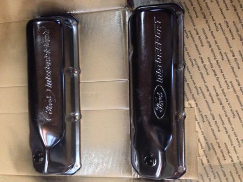 1979 Ford Bronco - Two black Ford Motorsport valve covers are laid out on a surface covered with shipping labels. The valve covers are embossed with the Ford…