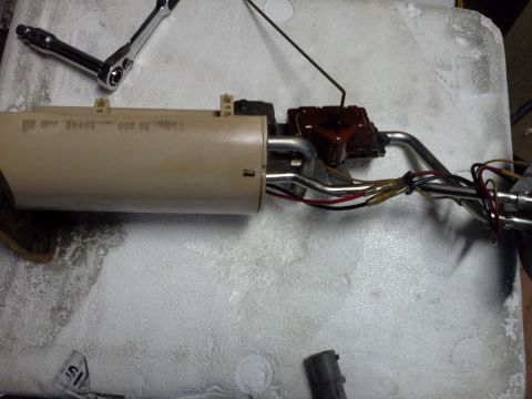 1996 Ford Bronco - Got the pump and sender out and as you can tell the pump has been replaced before because of the butt connectors on the red and black wires…