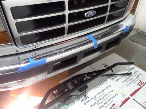 1996 Ford Bronco - Used painters tape to mark the center points on the bumper. There are 4 holes that have to be drilled and its easy to do once everything is…