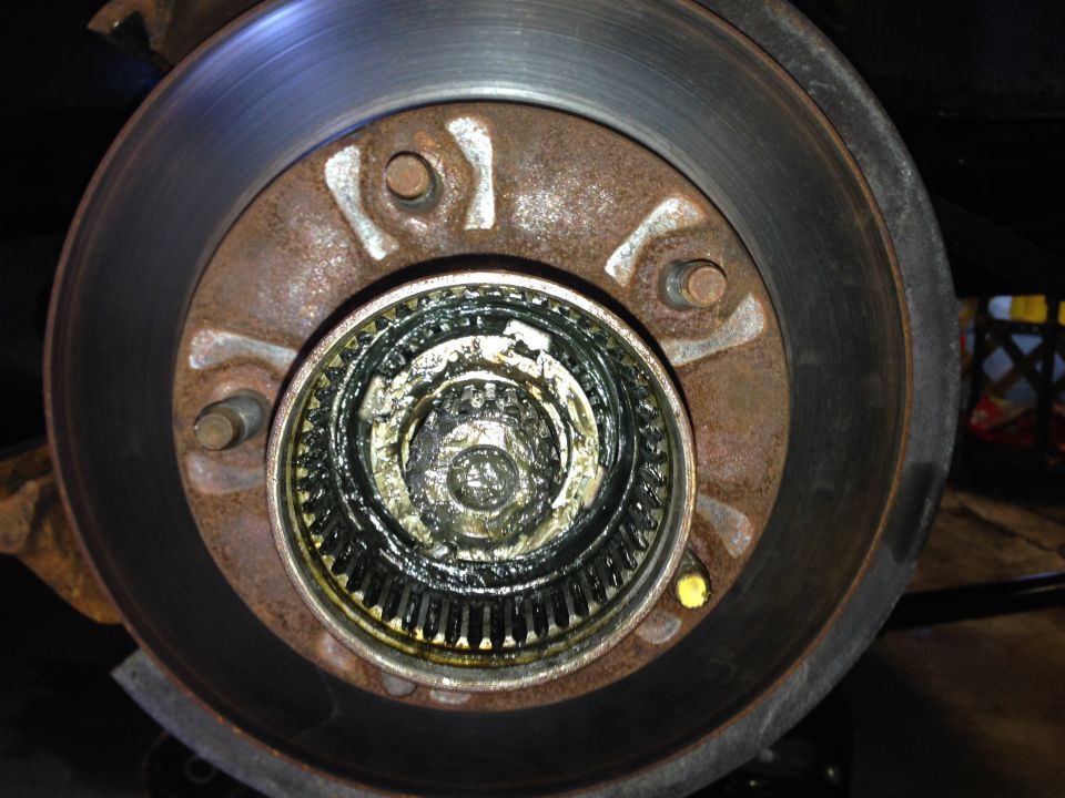 Lock washer.  You'll need a special 4-prong socket to unlock.  You can get them at any auto parts store.  Or ask around.  Someone is bound to have one.