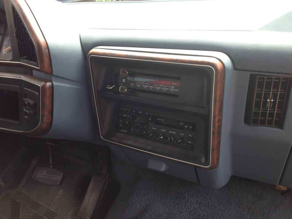 OEM radio.  I just don't have enough cassettes to make it worth keeping.