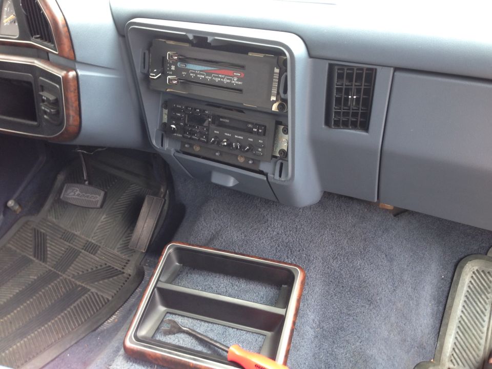 Truck dashboard center stack with aftermarket and factory radios