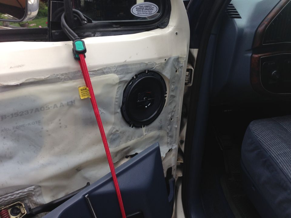 New Sony front speaker.  Had to drill a couple mounting holes but no big deal.  Didn't take the door panel completely off so I bungeed it in place.