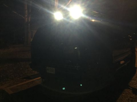 2005 Ford Excursion - Rear view of a 2005 Ford Excursion at night, equipped with bright aftermarket lights.