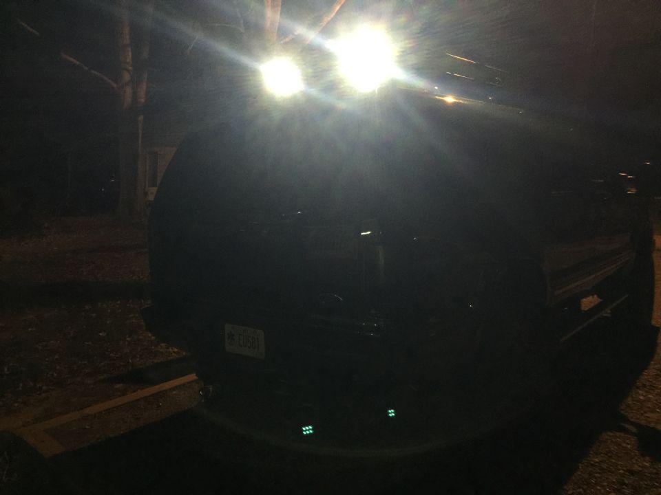 2005 Ford Excursion rear with aftermarket roof lights and license plate visible