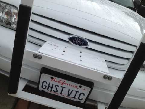 2004 Ford Crown Victoria - Front view of a 2004 Ford Crown Victoria, its grille and a custom California license plate.
