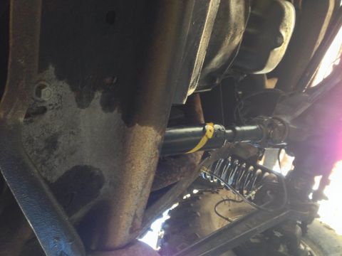 1979 Ford Bronco - Underside view shows driveshaft and suspension parts, no specific vehicle identified.