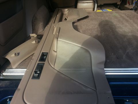 1994 Ford Bronco - Interior door panel and trim pieces are visible in the cargo area of a vehicle.