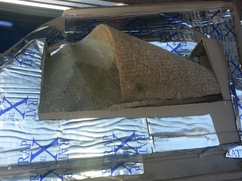 1994 Ford Bronco - Sound deadening material applied to the interior of a car door panel.