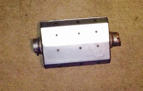 1996 Ford Bronco - Exhaust muffler shown on a carpeted surface. The part number is visible.