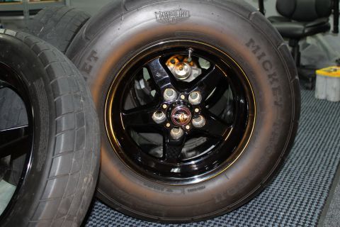 2003 Ford Crown Victoria - A close-up view of a black wheel and tire assembly, likely for a performance vehicle.