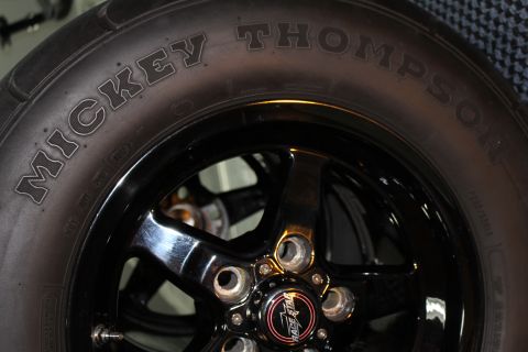 2003 Ford Crown Victoria - Close-up of a Mickey Thompson drag radial tire and a black five-spoke wheel.