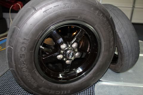 2003 Ford Crown Victoria - Close-up of Mickey Thompson drag radial tires mounted on black five-spoke wheels.