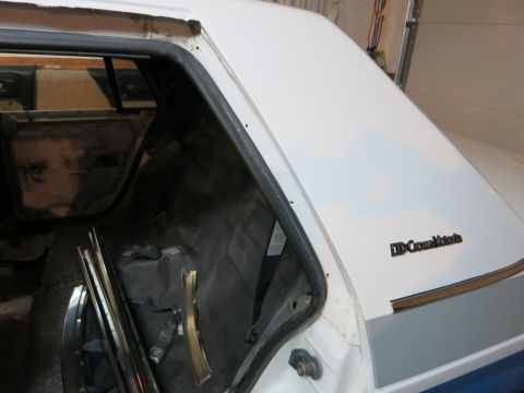 1991 Ford Crown Victoria LTD - Interior view of a 1991 Ford Crown Victoria LTD trunk, showing the seatbelt and some trim.