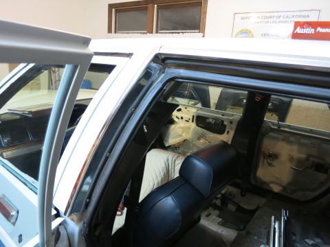 1991 Ford LTD Crown Victoria - Interior view of a car undergoing repairs, showing removed door panels and exposed components.