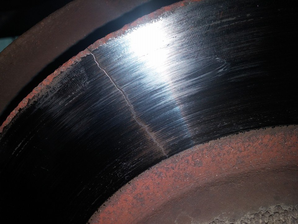 Cracked brake rotor with visible stress fracture