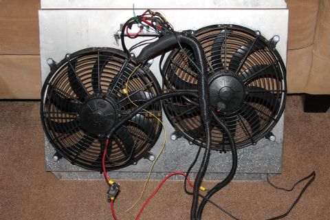 1995 Ford Bronco - This image shows a pair of electric cooling fans wired together, mounted on a metal enclosure.