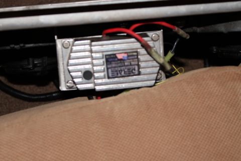 1995 Ford Bronco - A Derale transmission cooler control module is visible, attached under a seat.